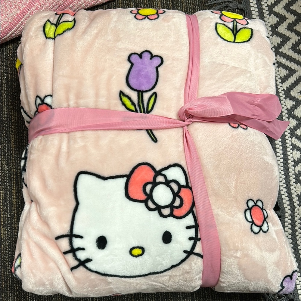 Hello kitty plush blanket pink with flowers on it